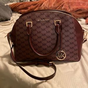 Michael Kors mini cross body logo purse.